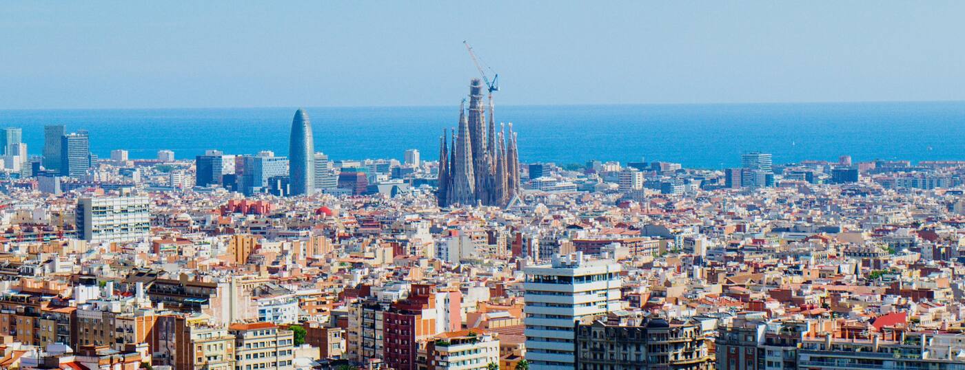 Barcelona skyline with the Sagrada Família, Torre Glòries and the Mediterranean Sea